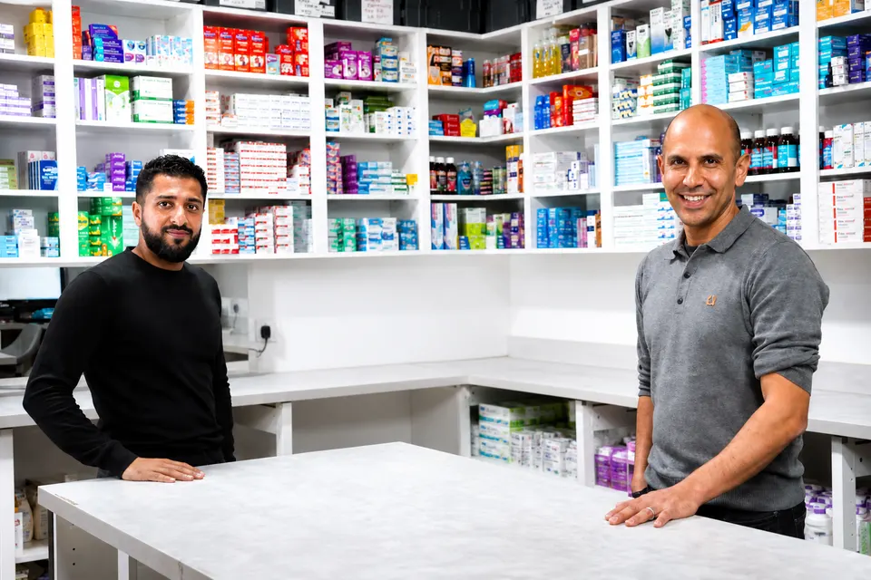 Addy Mohammed and Karim Nassar in a pharmacy dispensary